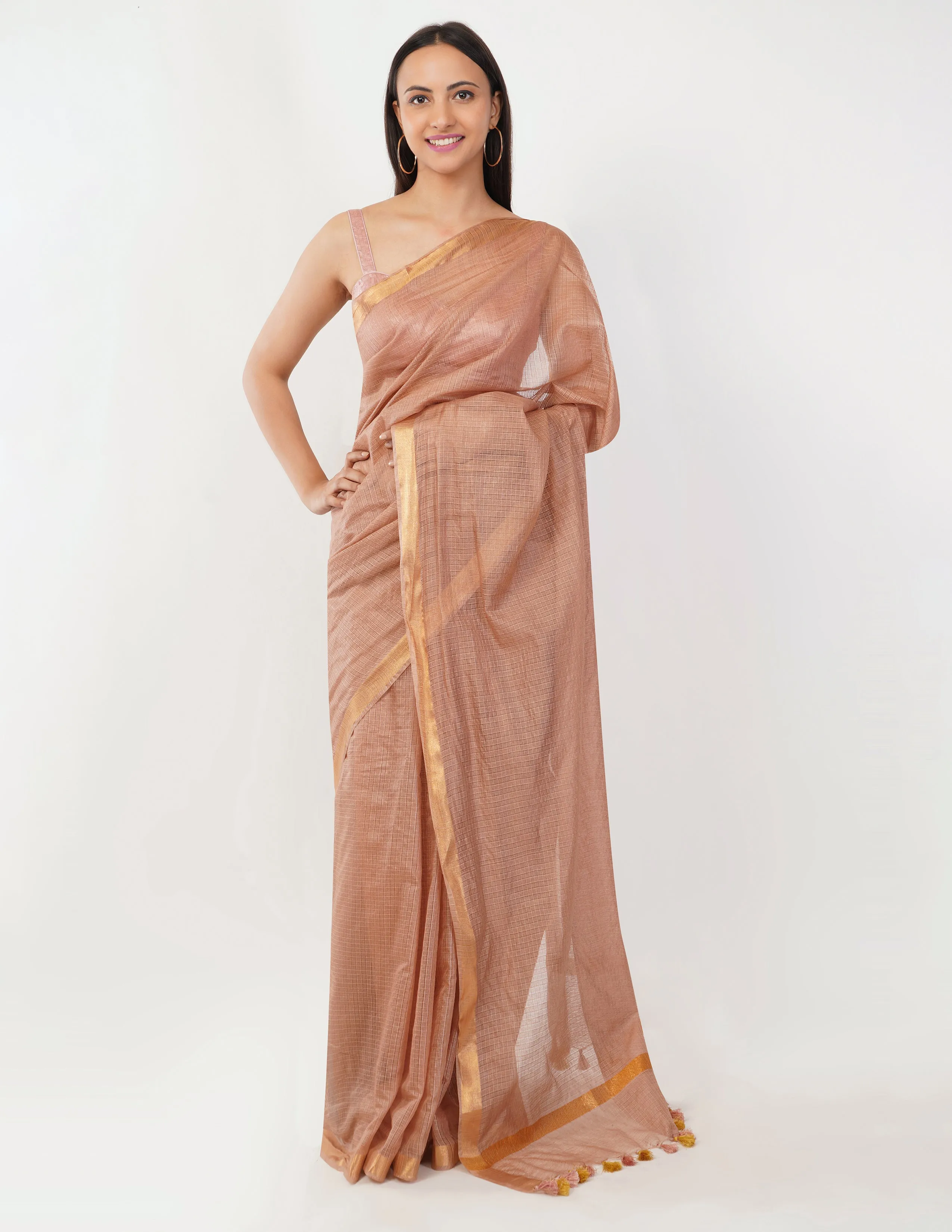 Blush-toned body with a subtle golden shimmer  Saree